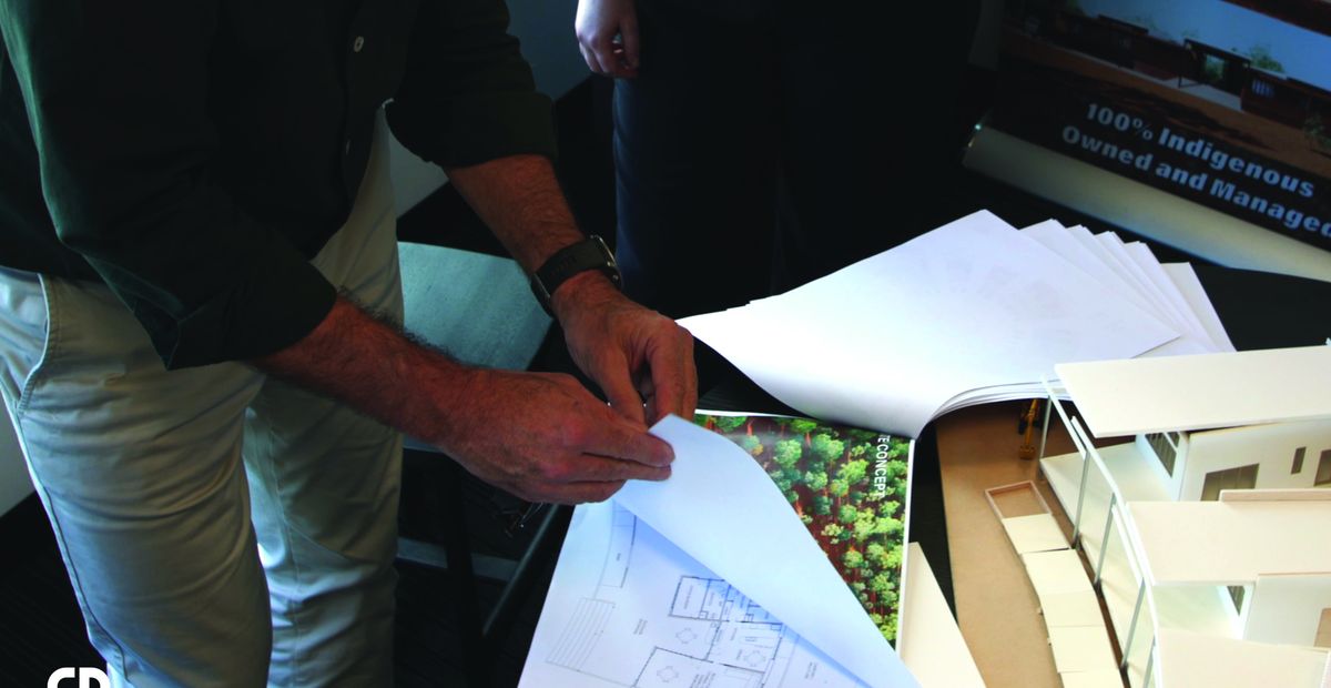 Engineers reviewing construction drawings